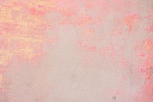 Texture of a concrete wall with cracks and scratches which can be used as a background photo