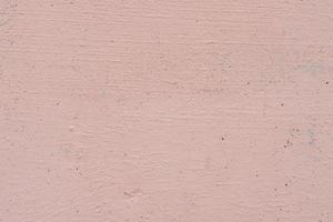 Texture of a concrete wall with cracks and scratches which can be used as a background photo