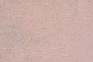 Texture of a concrete wall with cracks and scratches which can be used as a background photo