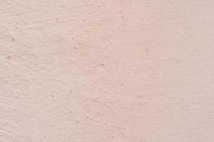 Texture of a concrete wall with cracks and scratches which can be used as a background photo