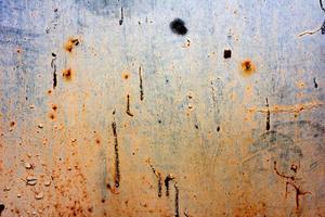 Metal texture with scratches and cracks which can be used as a background photo