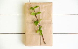 eco gift box decorated with birch leaves. Zero waste concept. photo