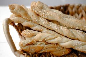 Italian grissini or salted breadsticks. sesame breadsticks photo