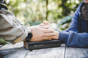 Group of people praying photo