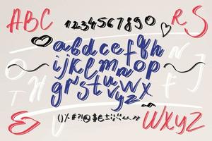 Cursive. Brush font. Uppercase letters, numbers, punctuation marks vector