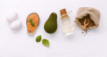 Ketogenic low carbs diet concept. Ingredients for healthy foods selection on white wooden background. photo