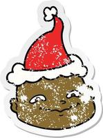 distressed sticker cartoon of a bald man wearing santa hat vector