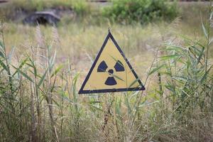 Nuclear Warning Sign in Chernobyl Exclusion Zone, Ukraine photo