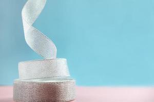 background of silver glitter fabric ribbon. photo