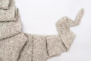 cozy grey knitted textured scarf . top view photo