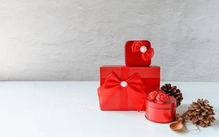 Red gift box on white wooden background photo