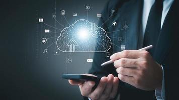 Cloud icon connecting to internet server service for downloading and uploading data on smartphones, cloud icons on virtual screens and social media icons. Applications and online businesses. photo