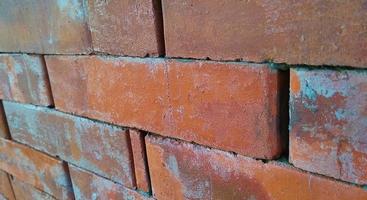 Red orange brick tile wall background. Architecture and building background design. photo