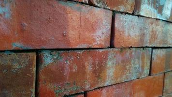 Red orange brick tile wall background. Architecture and building background design. photo