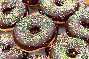 Chocolate donuts with chocolate shavings color on a traditional craftsman market.Horizontal image. photo