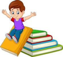 Cartoon little boy playing with large books vector