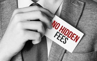 Closeup on businessman holding a card with text NO HIDDEN FEES photo