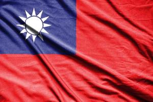 Realistic flag of  taiwan on the wavy surface of fabric photo