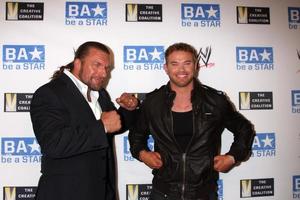 LOS ANGELES, AUG 11 - Triple H, Kellan Lutz arriving at the be A STAR Summer Event at Andaz Hotel on August 11, 2011 in Los Angeles, CA photo