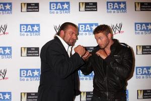 LOS ANGELES, AUG 11 - Triple H, Kellan Lutz arriving at the be A STAR Summer Event at Andaz Hotel on August 11, 2011 in Los Angeles, CA photo