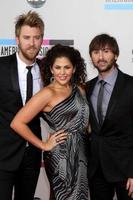 LOS ANGELES  NOV 21 - Lady Antebellum  Charles Kelley, Hillary Scott, and Dave Haywood arrives at the 2010 American Music Awards at Nokia Theater on November 21, 2010 in Los Angeles, CA photo