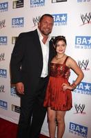 LOS ANGELES, AUG 11 - Triple H, Ariel Winter arriving at the be A STAR Summer Event at Andaz Hotel on August 11, 2011 in Los Angeles, CA photo