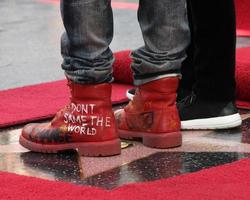 LOS ANGELES, DEC 4 - Ellen DeGeneres, Pharrell Williams at the Pharrell Williams Hollywood Walk of Fame Star Ceremony at the W Hotel Hollywood on December 4, 2014 in Los Angeles, CA photo