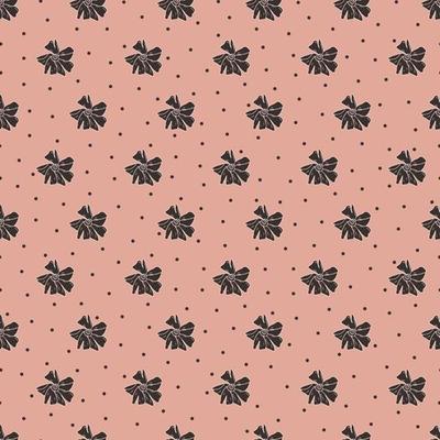 A simple cute pattern of small black flowers on a powder-colored background. Floral seamless background. An elegant template for fashionable prints.