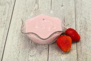 Yoghurt with strawberry in the bowl photo