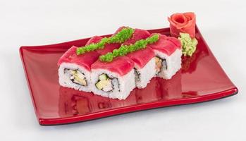 Maki Sushi - Roll made of Crab, avocado, cucumber inside. Fresh Tuna and tobico roe outside photo