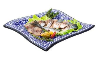 Mackerel fish, sliced on a plate with lettuce photo