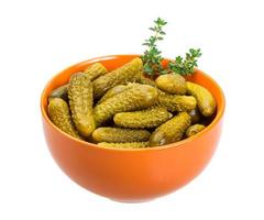 Marinated cucumbers, pickles in a bowl photo