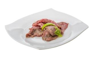 Beef carpaccio on white background photo