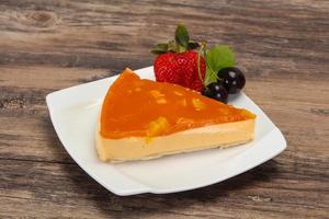 Cheesecake with apricot served strawberry photo