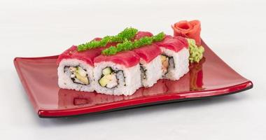 Maki Sushi - Roll made of Crab, avocado, cucumber inside. Fresh Tuna and tobico roe outside photo
