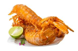 Grilled crawdads on white background photo