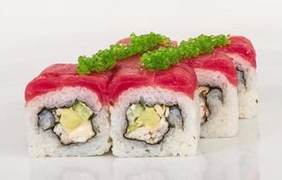 Maki Sushi - Roll made of Crab, avocado, cucumber inside. Fresh Tuna and tobico roe outside photo