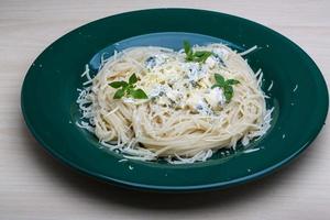 Pasta with blue cheese and basil photo