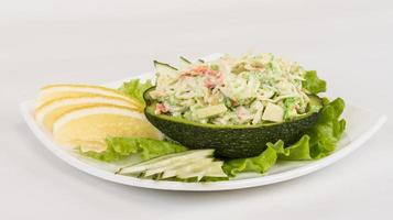 Crab meat salad with green caviar in avocado - japan cusine photo