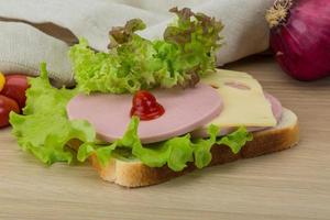 Sandwich with cheese and sausages photo