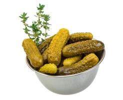 Marinated cucumbers, pickles in a bowl photo