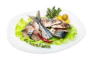 Mackerel fish, sliced on a plate with lettuce photo