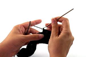 Women's hands doing crochet work photo