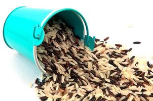 Rice bucket on white background photo