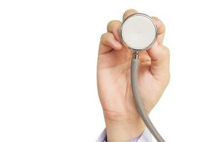 Doctor is going to examine his patient using his stethoscope isolated over white. Photo includes CLIPPING PATH.