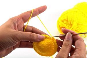 Women's hands doing crochet work photo