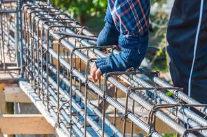 Construction worker is working on reinforced concrete steel structure photo