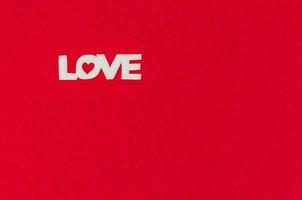 Love word on red background photo