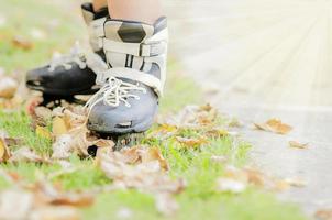 Closeup of boy is standing with roller blade, selective focused. photo