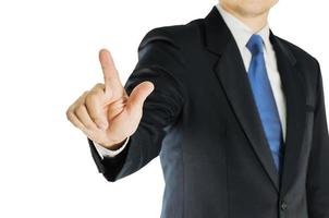 Businessman is pointing, pushing, or touching forward over white background. Photo is focused at hand. Photo includes clipping path.